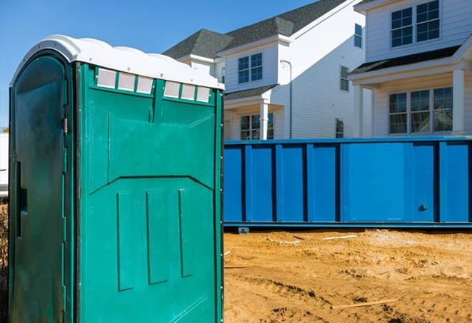 a line of port-a-potties offering a necessary break from work on a job site